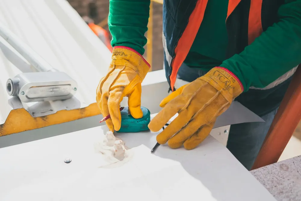 Envirolux technician sealing a window frame